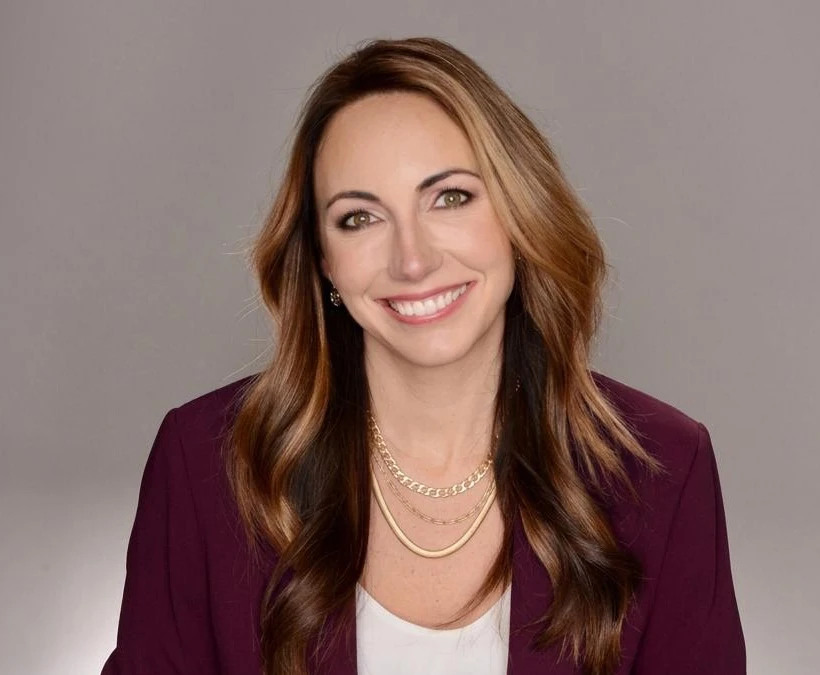 Jocelyn Reyburn wearing a dark plum blazer